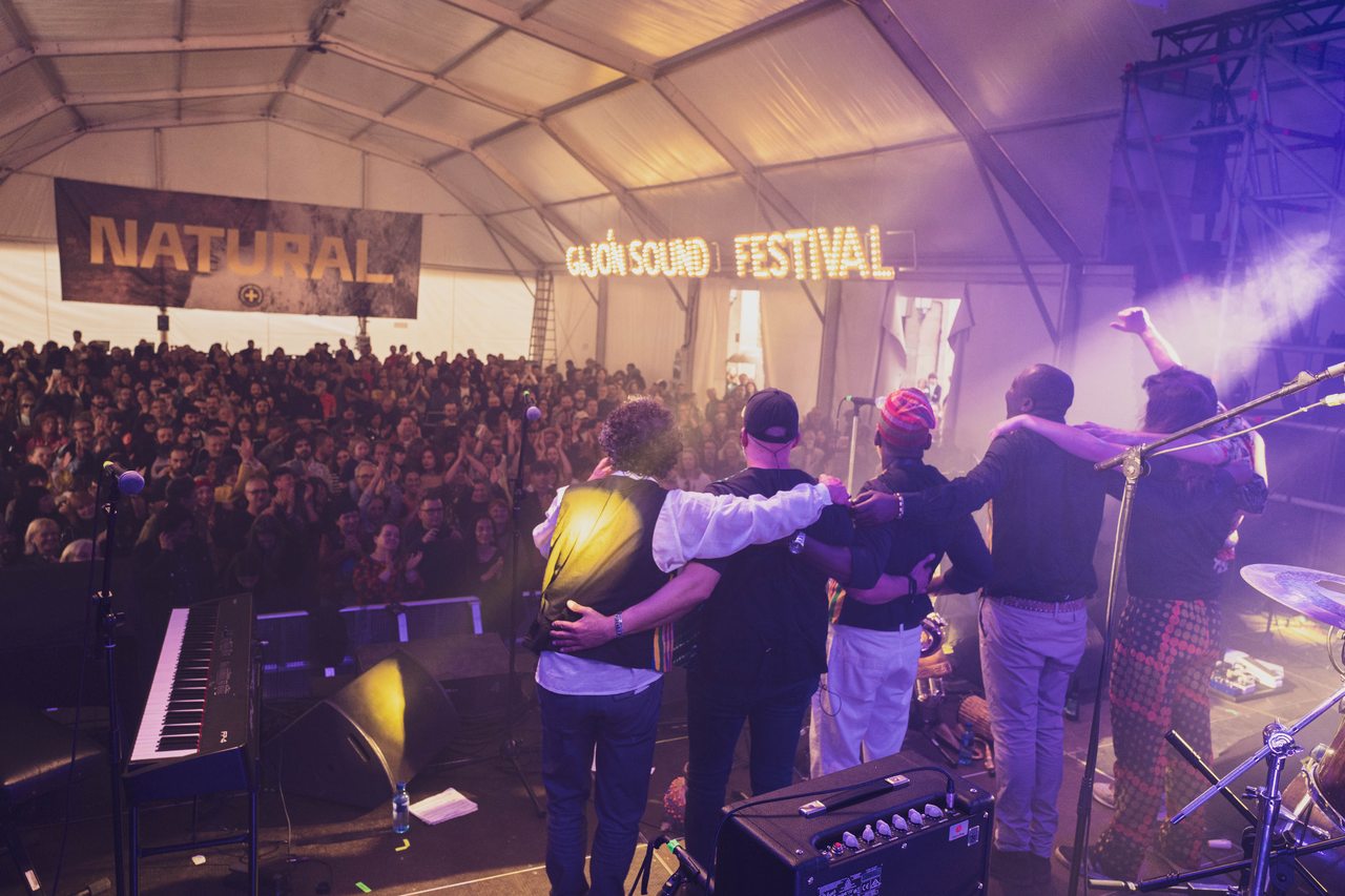 Performers face a crowded audience from the Gijón Sound Festival stage